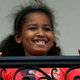 U.S. President Barack Obama’s daughter Sasha watches him from the Truman Balcony after he arrived on the south lawn of the White House via Marine One May 14, 2009 in Washington, DC.